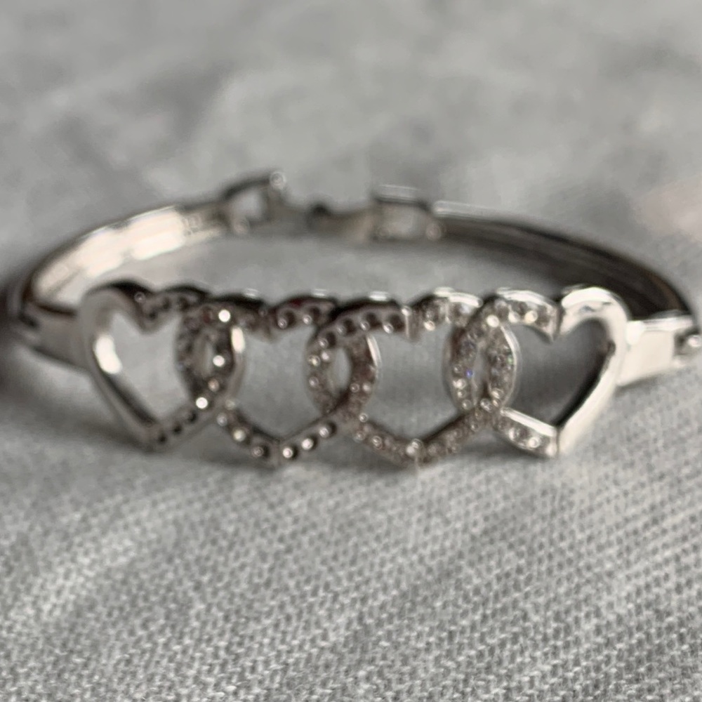 Heart cuffed hinged silver bracelet.